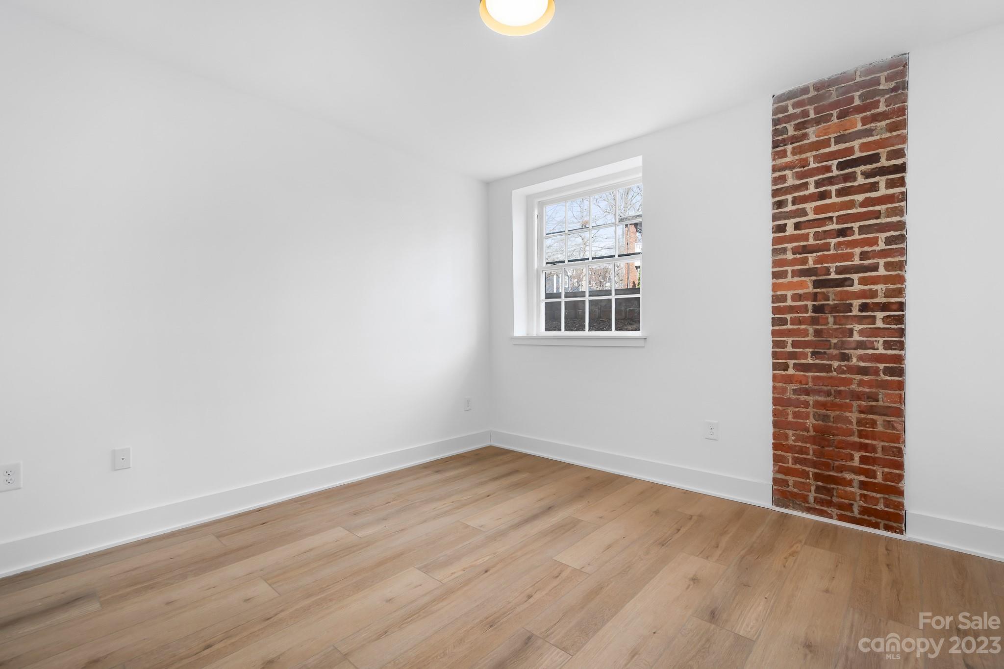 201 Grandin Road, Unit 12 Charlotte, NC 28208 - Photo 11 of 13 an empty room with windows