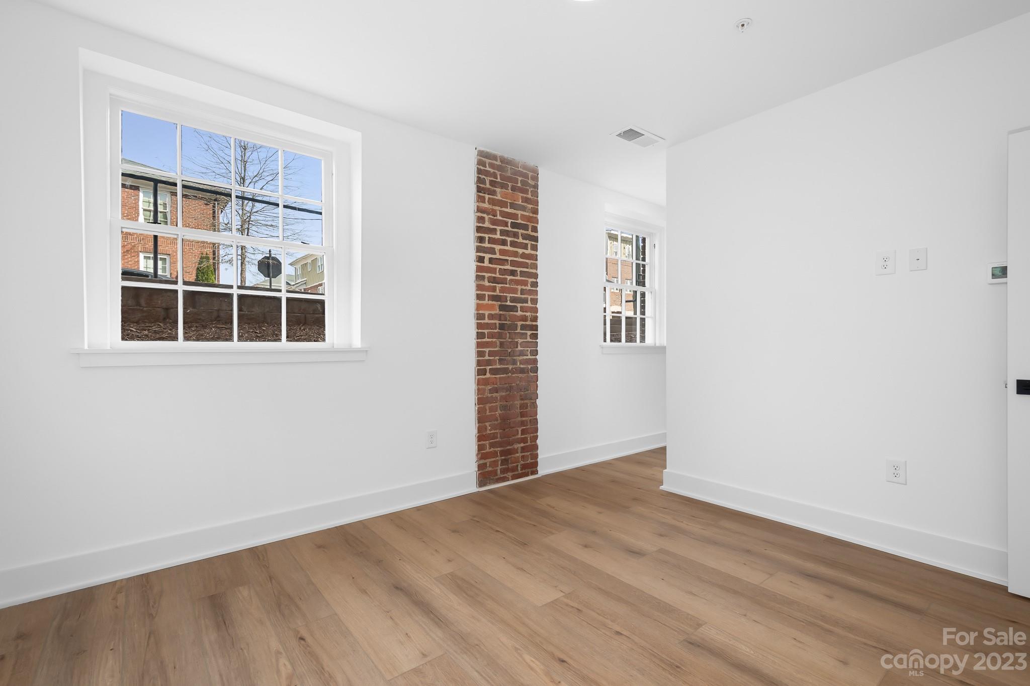 201 Grandin Road, Unit 12 Charlotte, NC 28208 - Photo 12 of 13 a view of empty room with windows