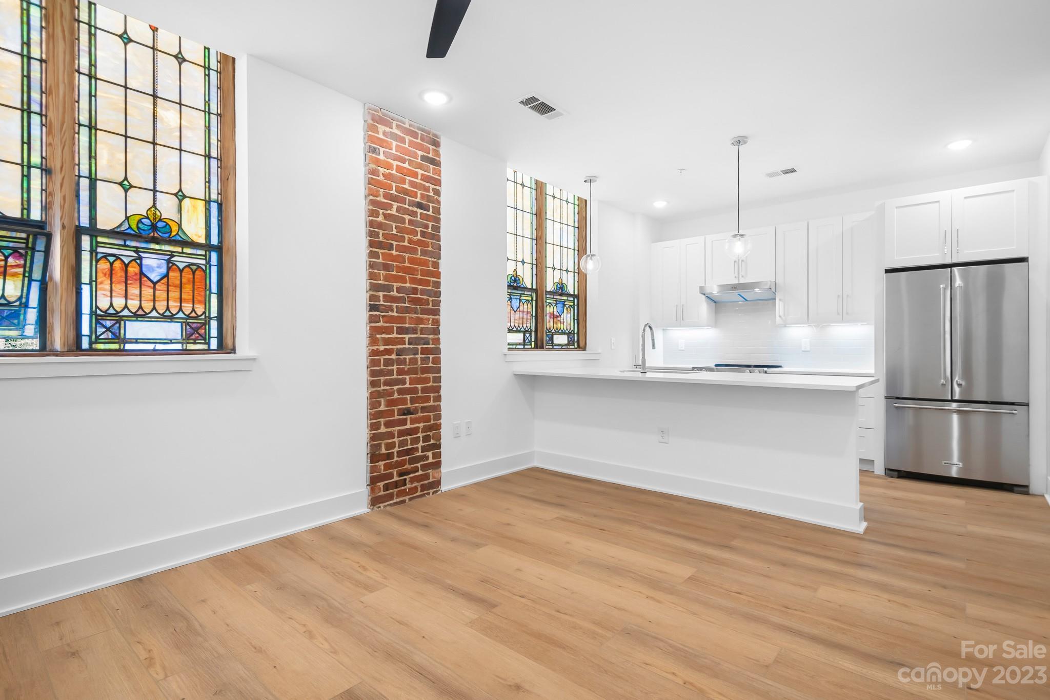 201 Grandin Road, Unit 12 Charlotte, NC 28208 - Photo 3 of 13 a view of kitchen and front door