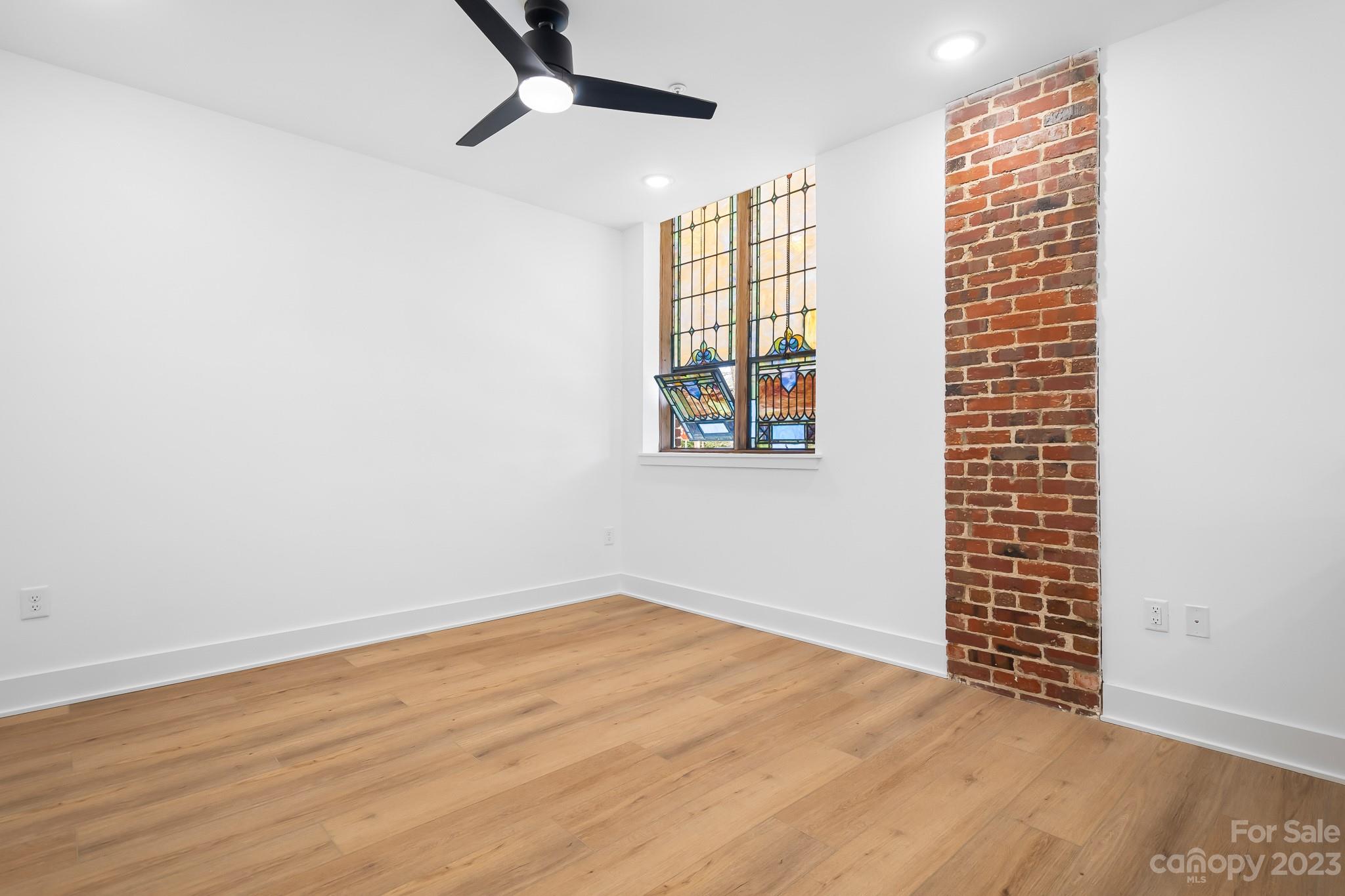 201 Grandin Road, Unit 12 Charlotte, NC 28208 - Photo 4 of 13 an empty room with windows