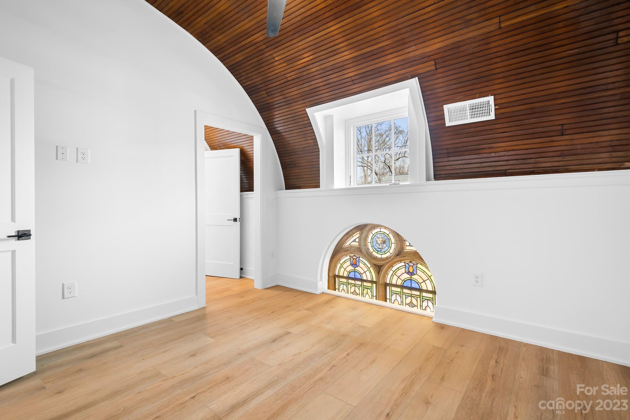 201 Grandin Road, Unit 12 Charlotte, NC 28208 - Photo 5 of 13 a view of a hallway with wooden floor