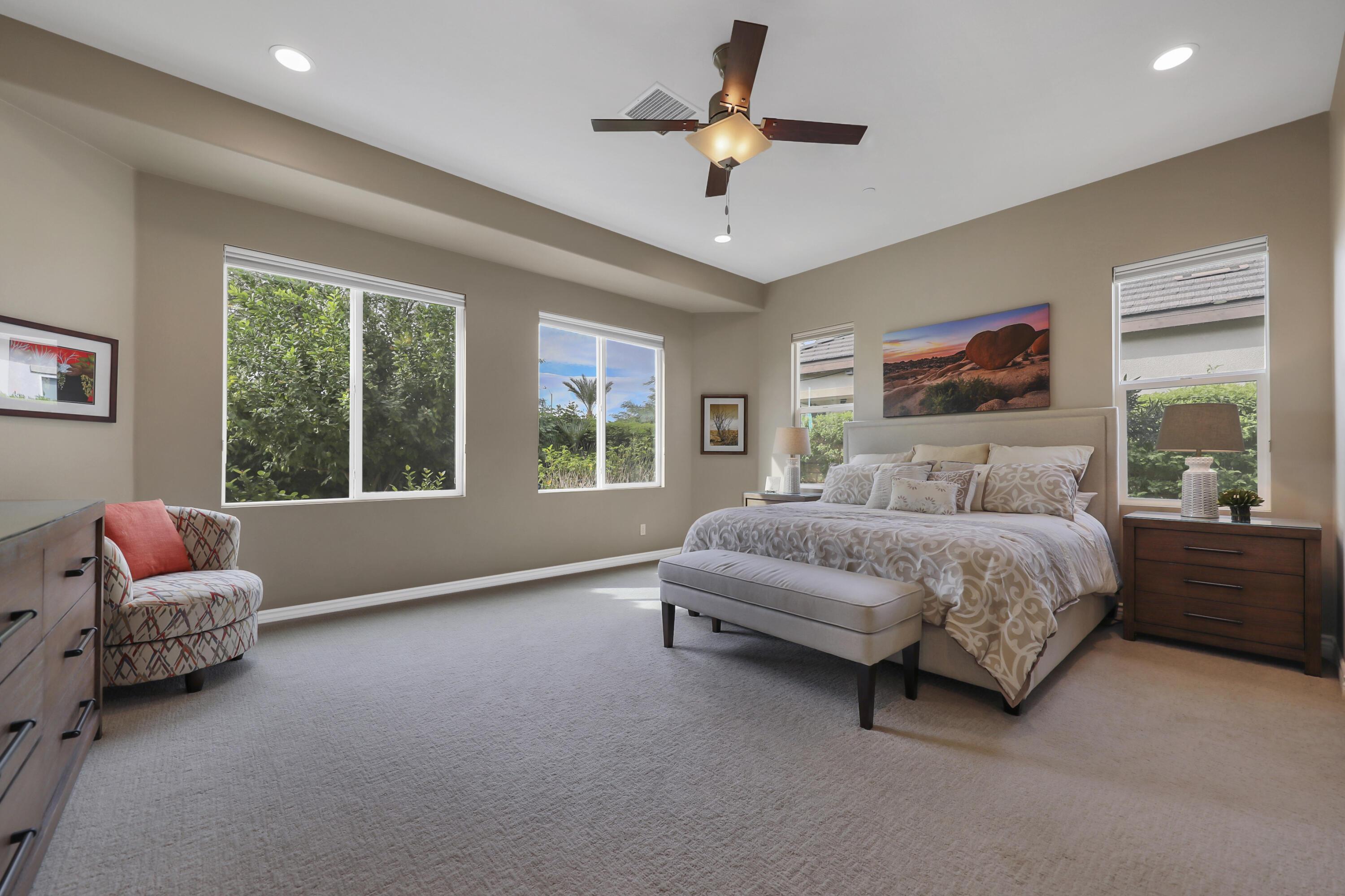 85685 Treviso Drive Indio, CA 92203 - Photo 15 of 32 a bedroom with a bed chandelier and window