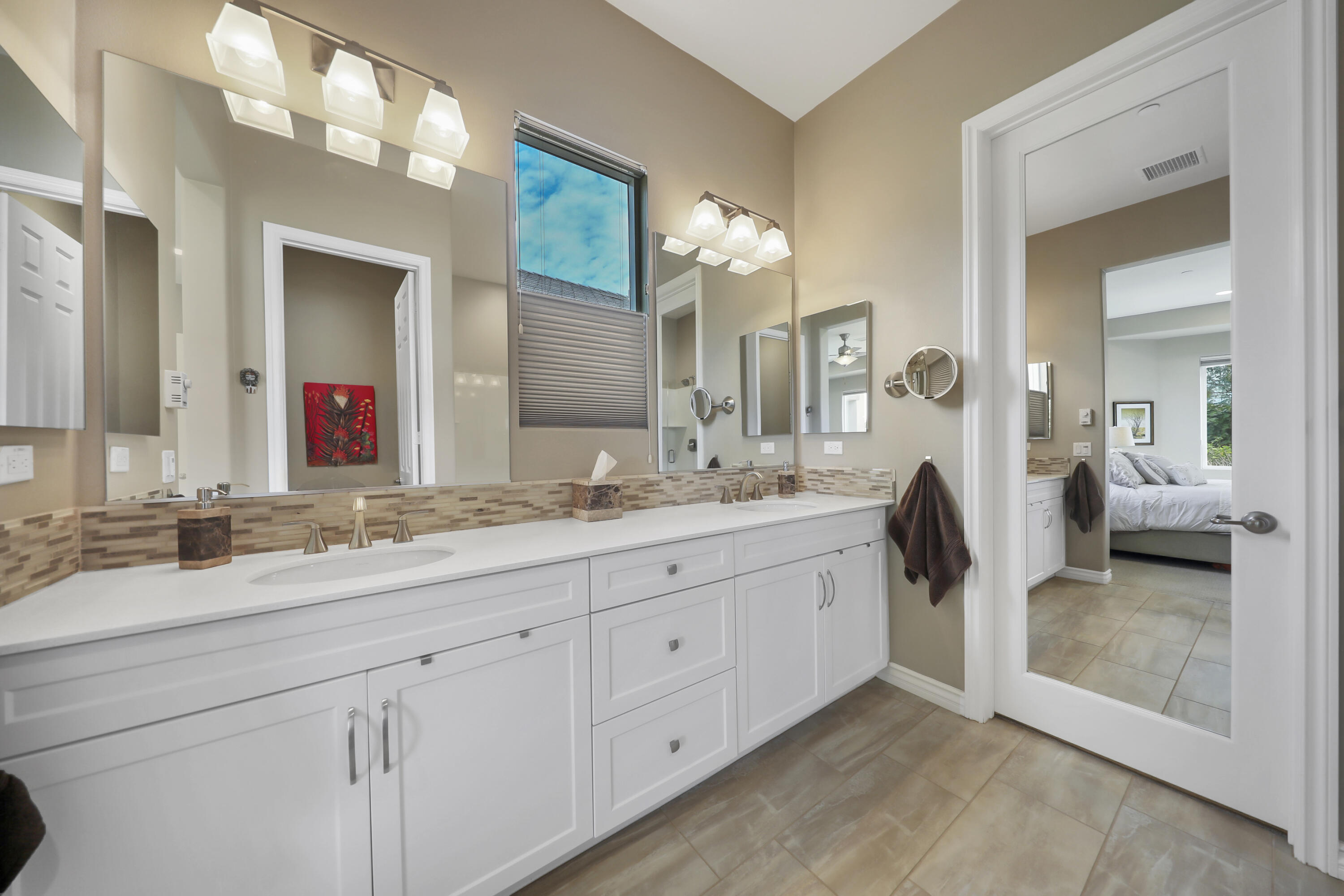 85685 Treviso Drive Indio, CA 92203 - Photo 17 of 32 a bathroom with a sink and a mirror