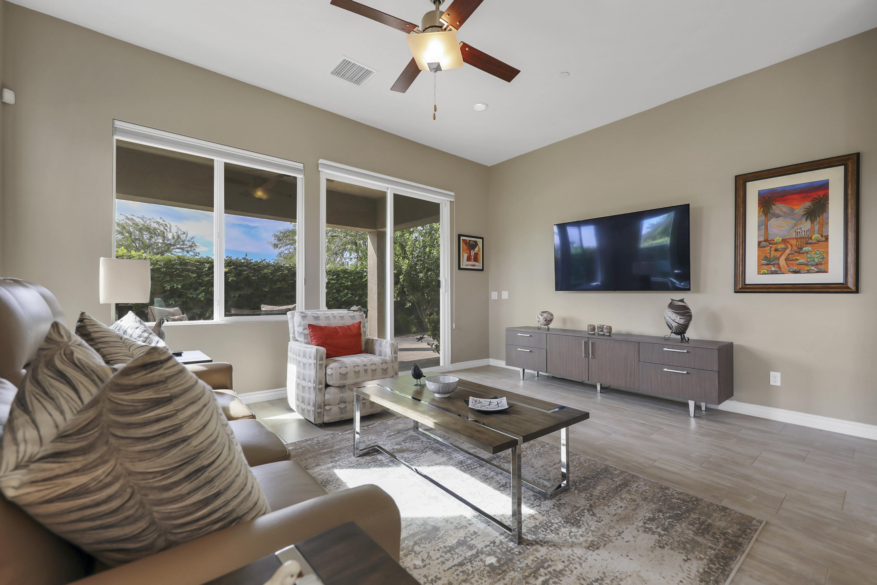 85685 Treviso Drive Indio, CA 92203 - Photo 7 of 32 a living room with furniture and a flat screen tv