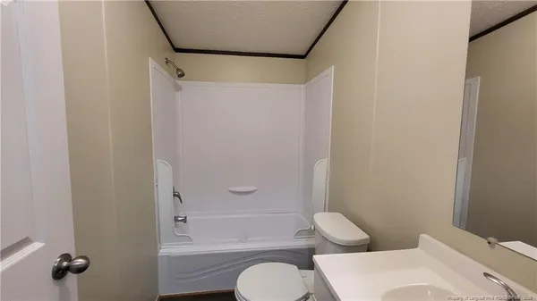a bathroom with a toilet and shower