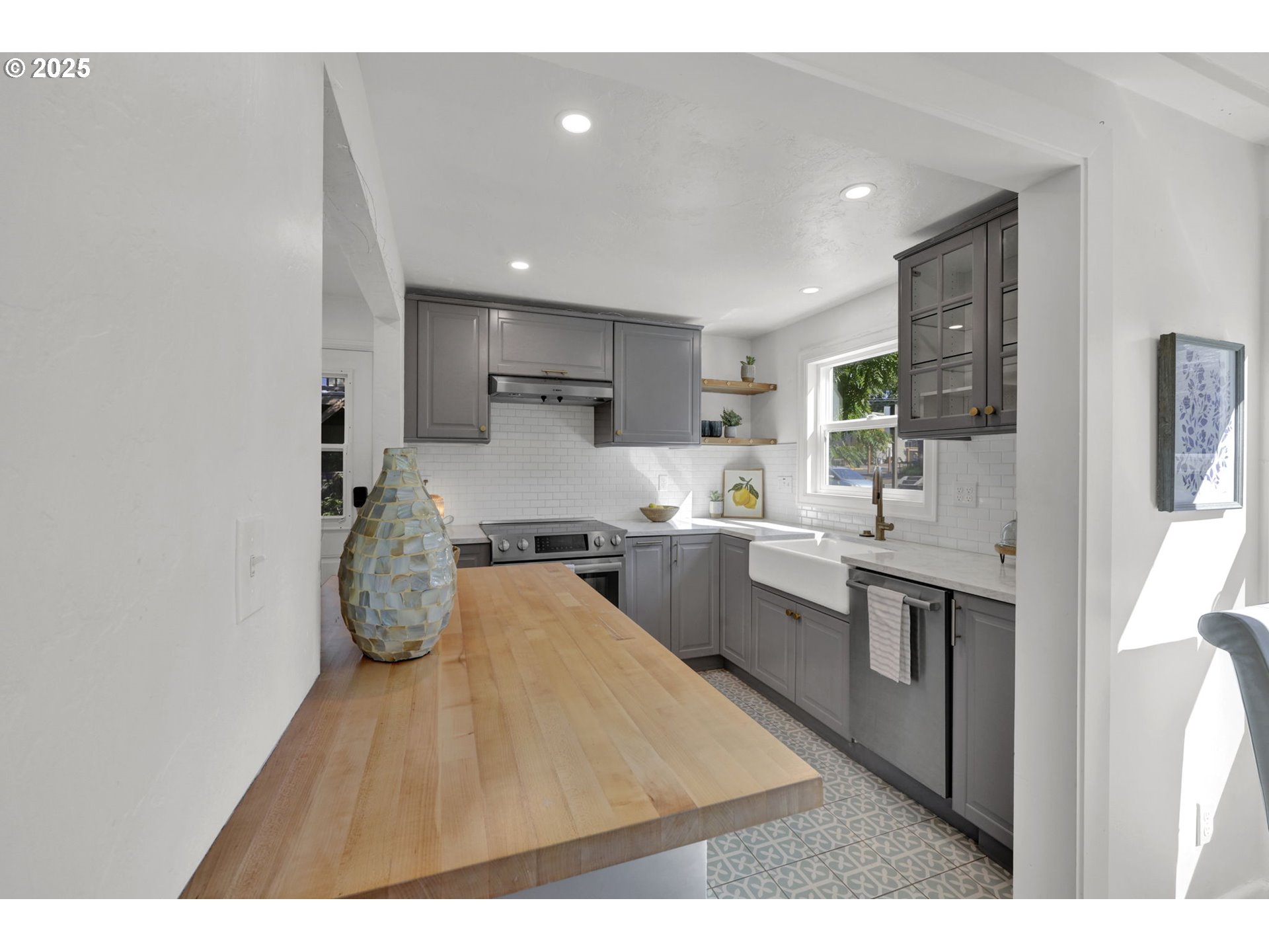 2424 Nixon Street Eugene, OR 97403 - Photo 14 of 48 a open kitchen with kitchen island a sink stove and refrigerator