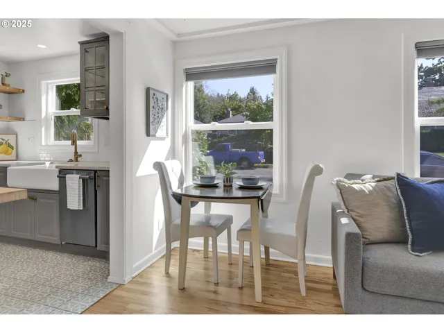 a dining room with furniture and window