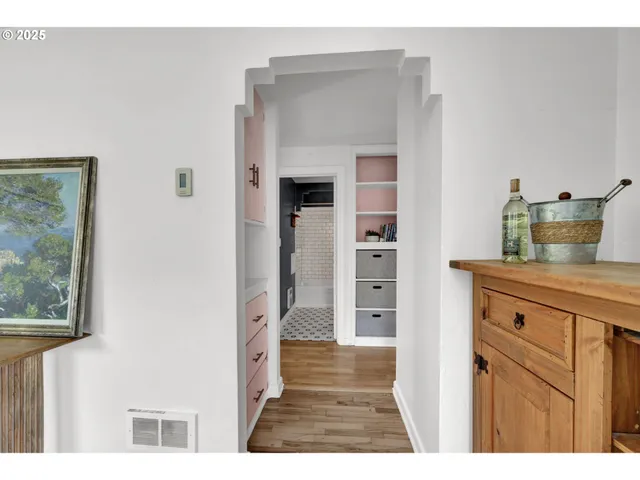 a kitchen with granite countertop a refrigerator and a sink