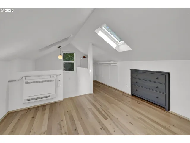 a view of a livingroom with wooden floor