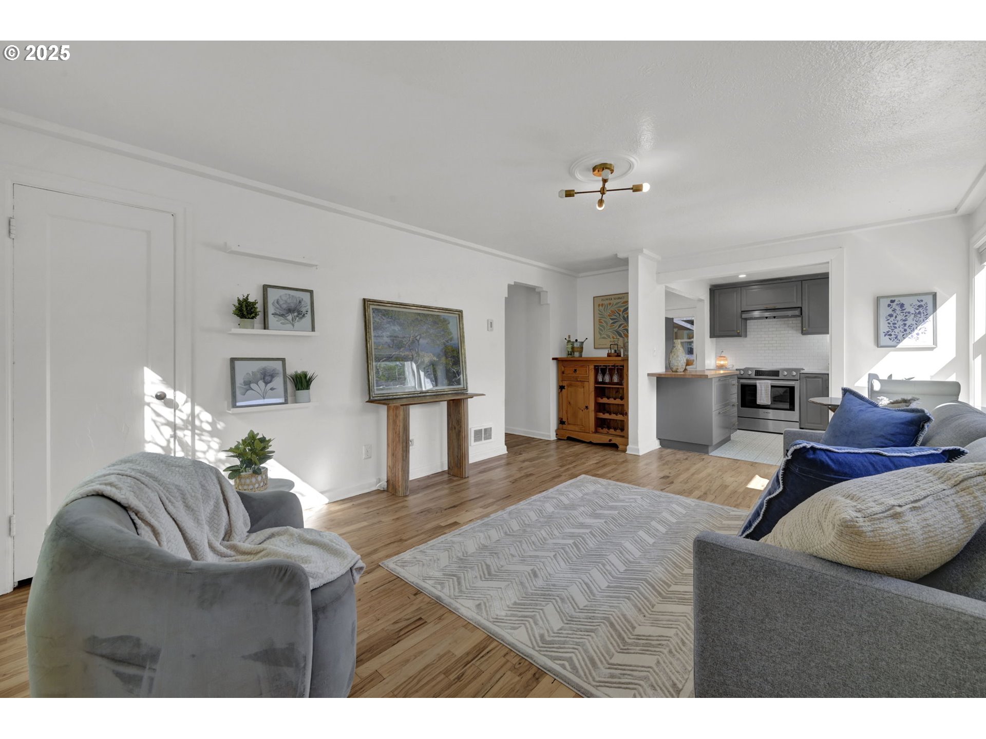 2424 Nixon Street Eugene, OR 97403 - Photo 5 of 48 a living room with furniture and wooden floor