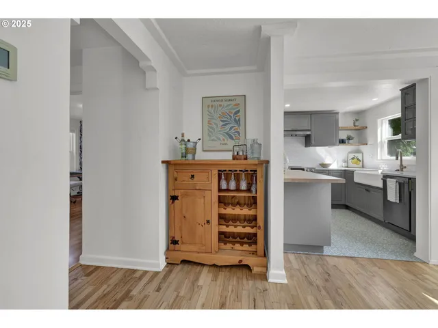 a kitchen with kitchen island a stove a sink and a refrigerator