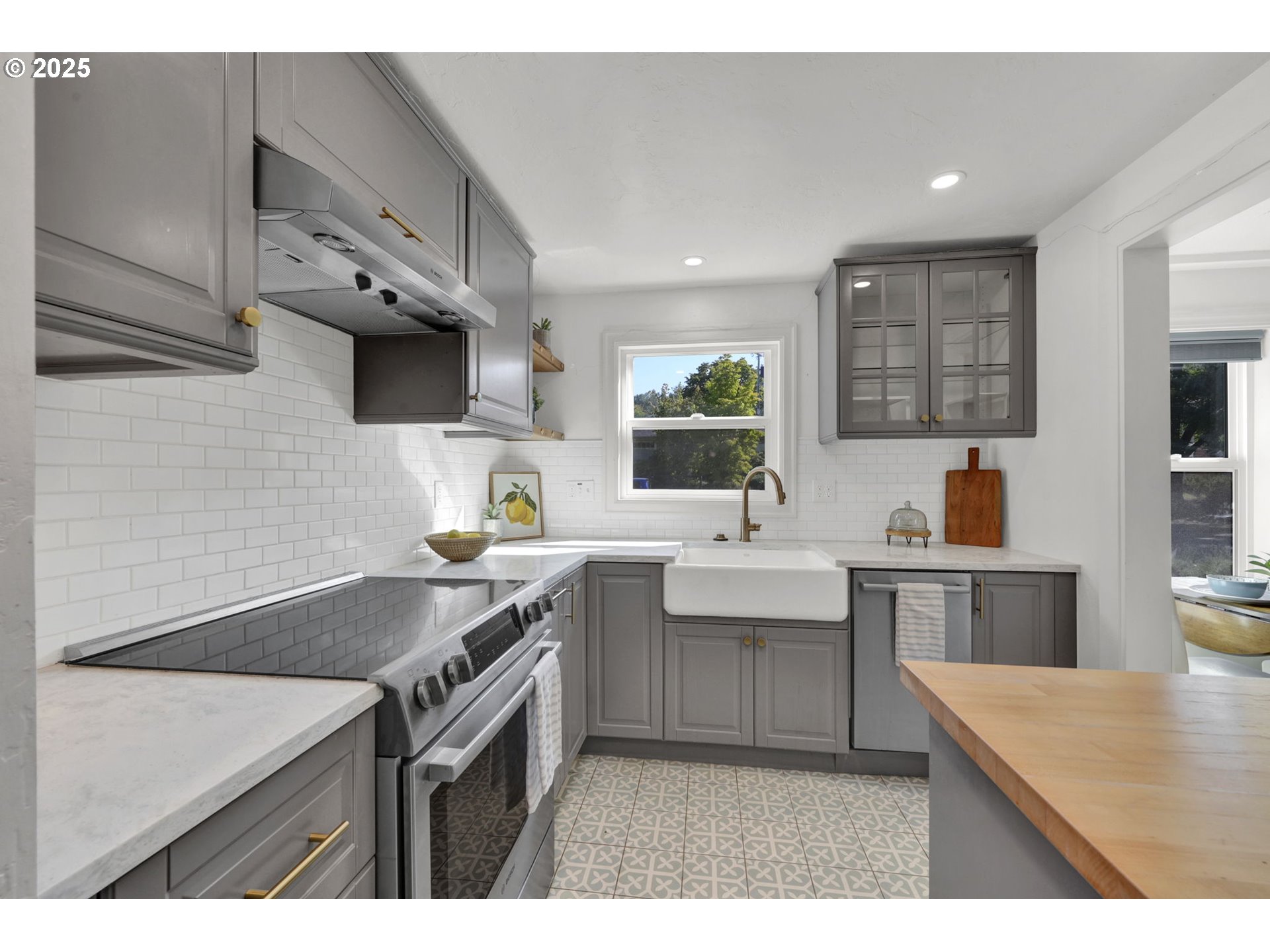 2424 Nixon Street Eugene, OR 97403 - Photo 9 of 48 a kitchen with stainless steel appliances granite countertop a sink stove and refrigerator
