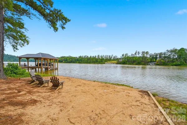 a view of swimming pool with a lake view