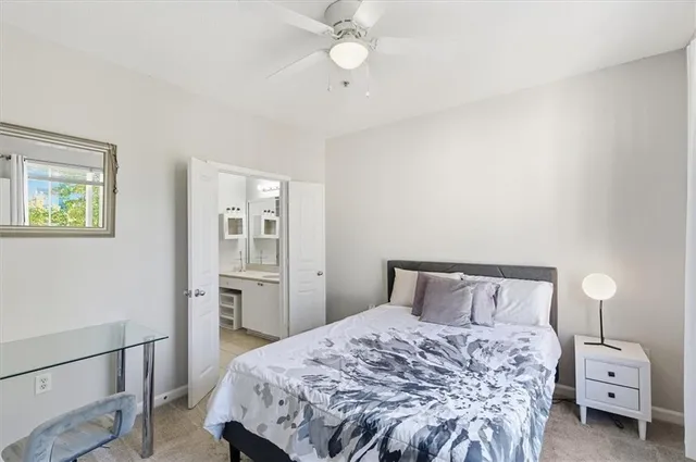 a bedroom with a bed and a couch