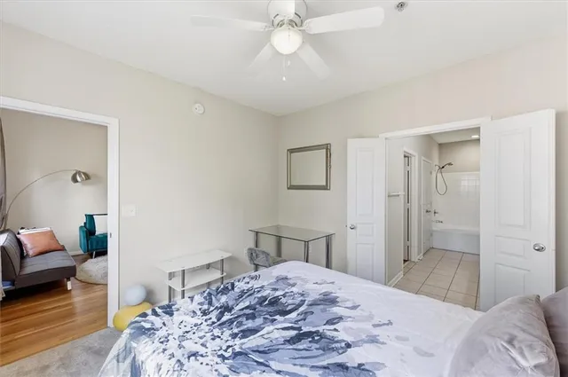 a bedroom with a bed and window