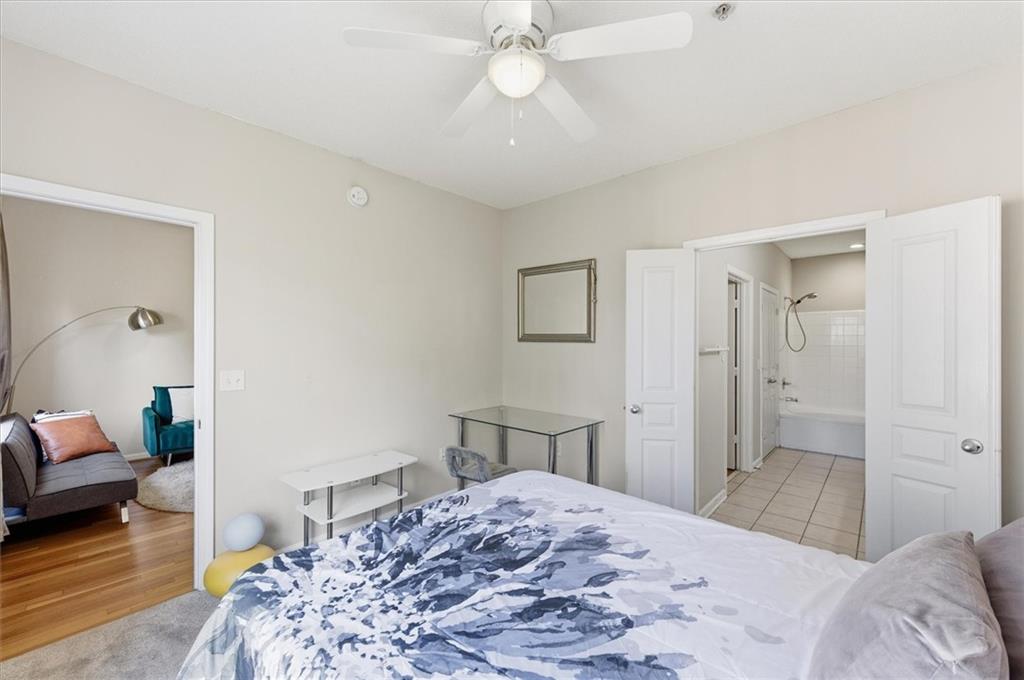 10 Perimeter Summit Boulevard, Unit 2410 Atlanta, GA 30319 - Photo 17 of 31 a bedroom with a bed and a couch