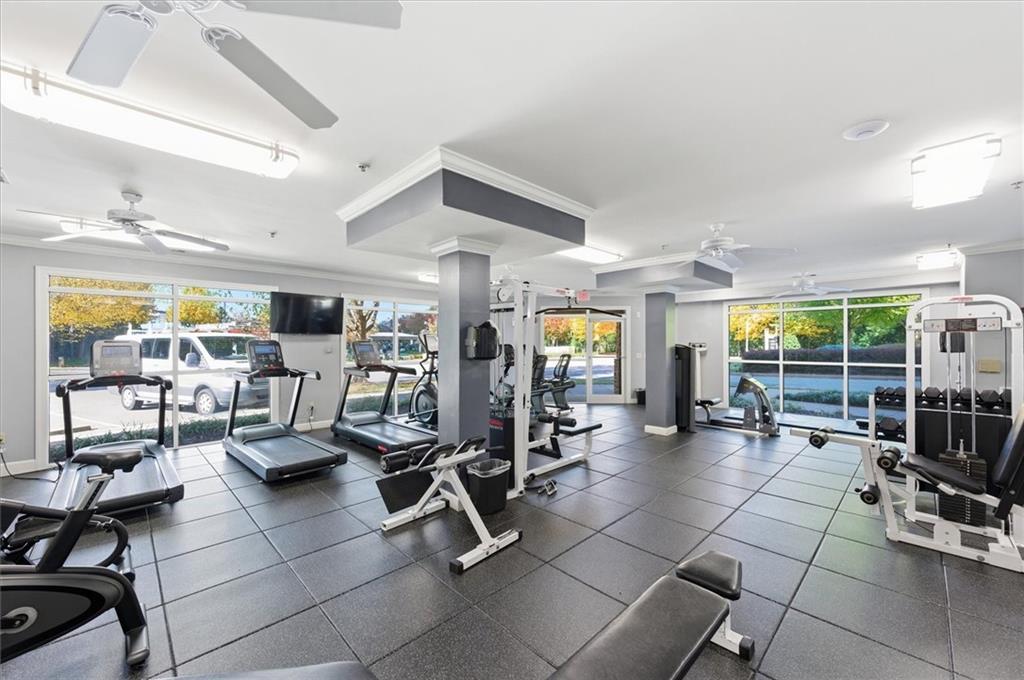 10 Perimeter Summit Boulevard, Unit 2410 Atlanta, GA 30319 - Photo 25 of 31 a gym with lots of chairs and mirrors