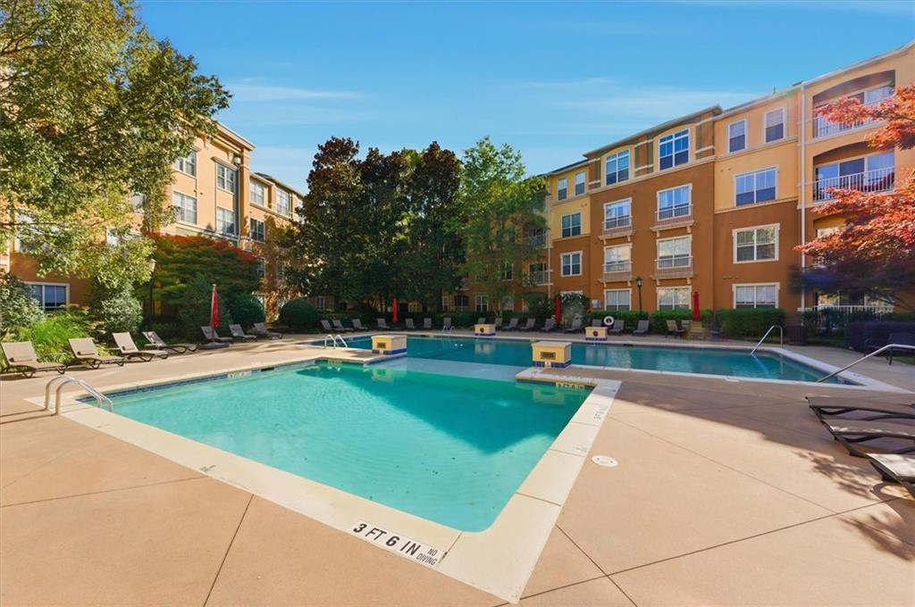 10 Perimeter Summit Boulevard, Unit 2410 Atlanta, GA 30319 - Photo 26 of 31 a view of a building and a yard