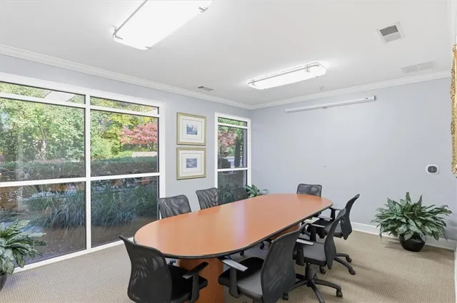 a kitchen with a table and chairs in it