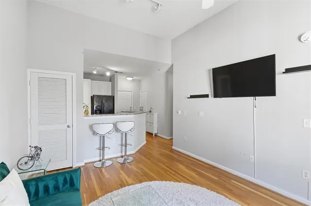 a kitchen with appliances a sink and cabinets