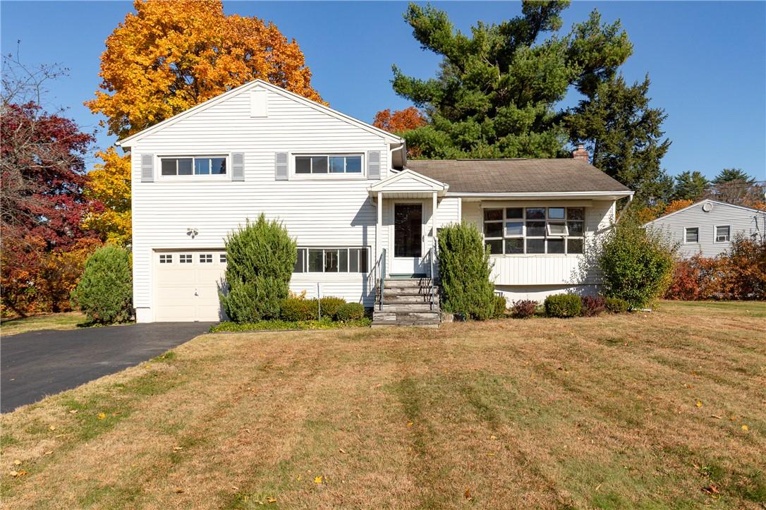 1 Lynbrook Road Poughkeepsie, NY 12603 - Photo 1 of 1 Split level home featuring a front lawn and a garage