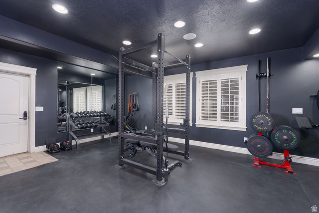 687 South 2080th Street East Springville, UT 84663 - Photo 39 of 149 Dedicated fitness room featuring recessed lighting, dark painted walls, and a black rubberized floor