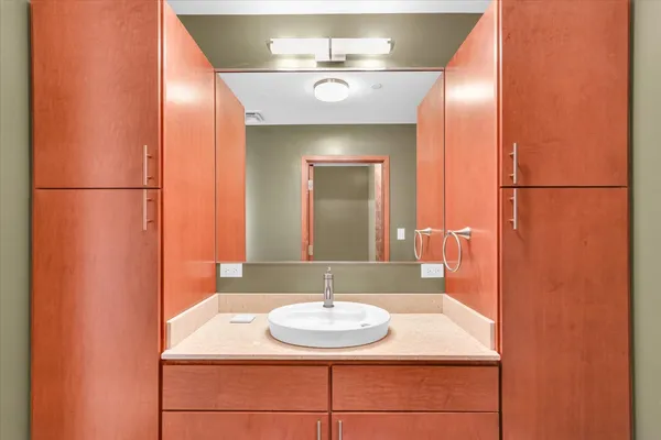 a bathroom with a sink and a mirror