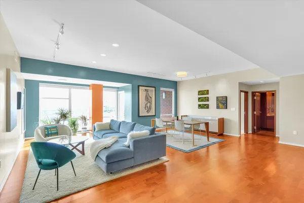 a living room with furniture and a large window