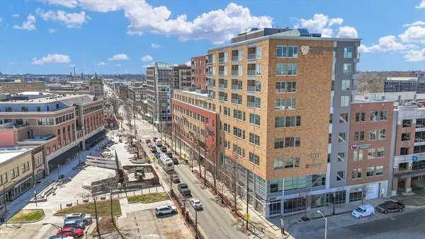 a view of a building with a yard