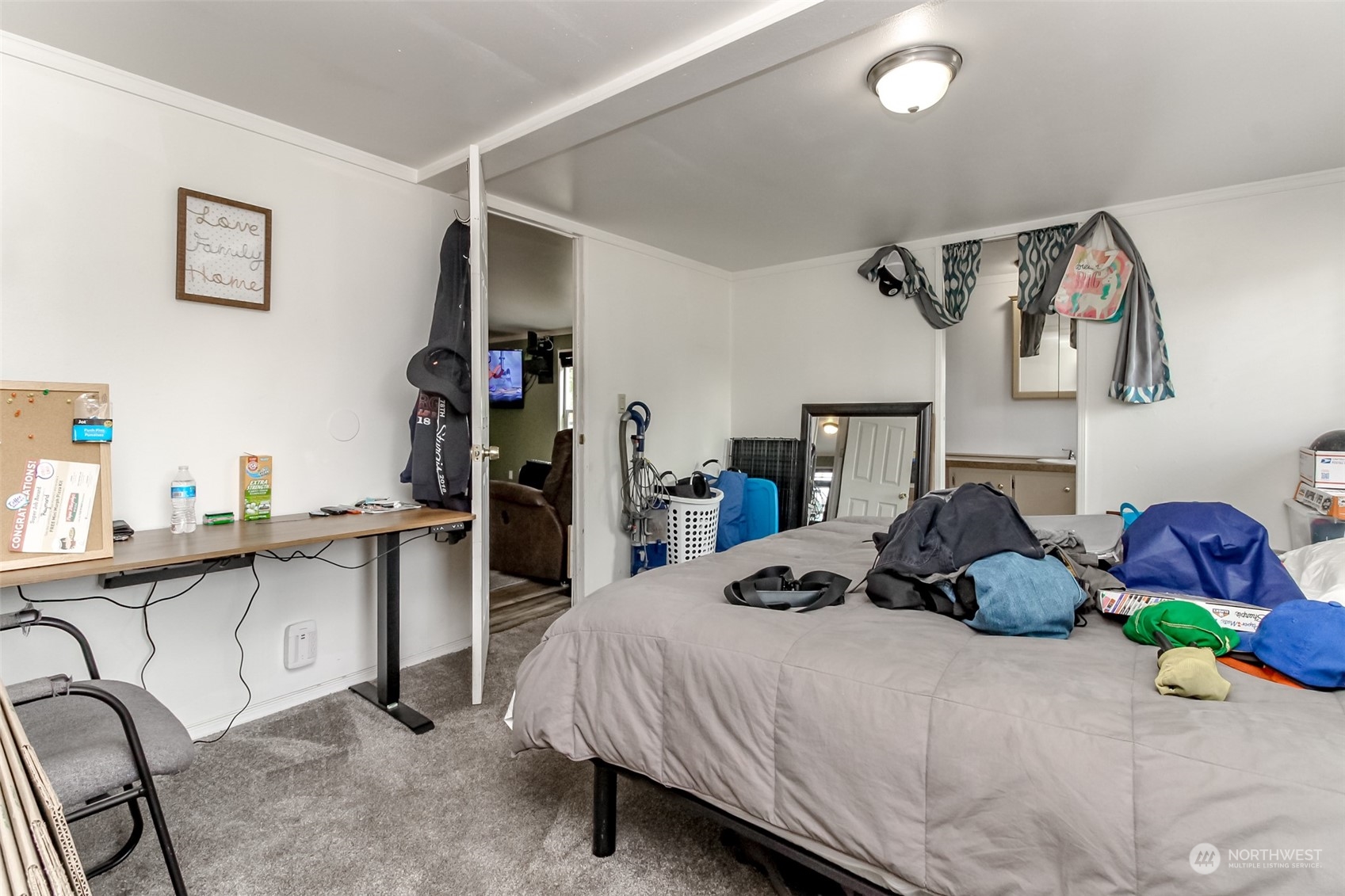 224 Military Road East Tacoma, WA 98445 - Photo 8 of 20 a bedroom with a bed and cabinets