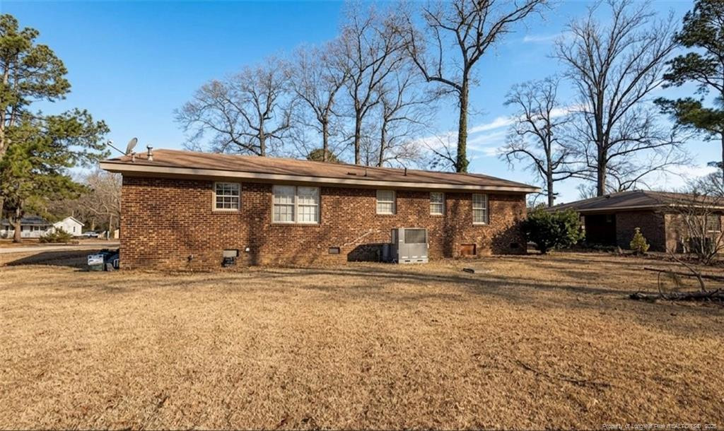 107 East Thigpen Road Conetoe, NC 27819 - Photo 13 of 13 a view of a house with a large tree and a yard