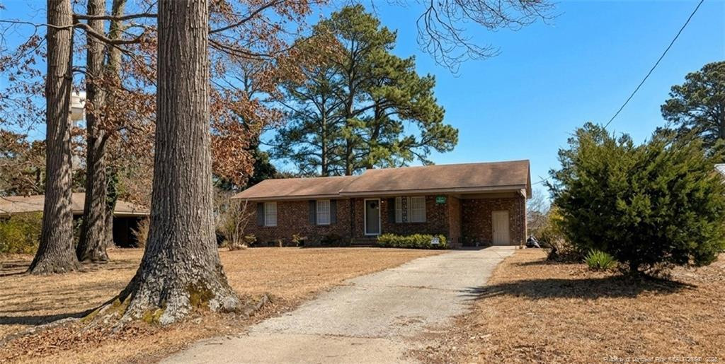 107 East Thigpen Road Conetoe, NC 27819 - Photo 2 of 13 a view of a white house with a large tree