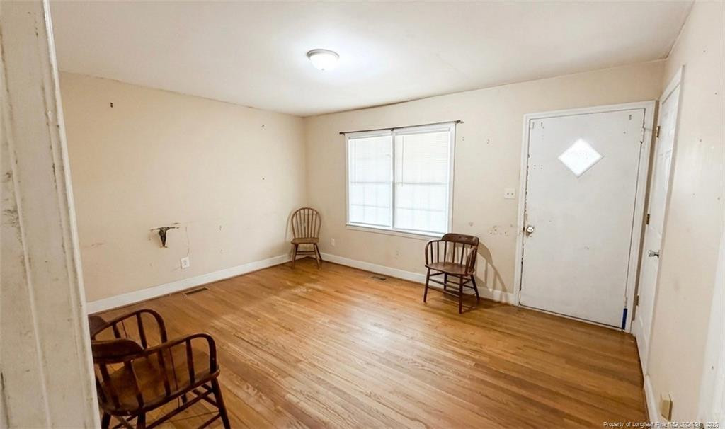 107 East Thigpen Road Conetoe, NC 27819 - Photo 6 of 13 a view of a room with window and wooden floor