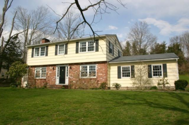 10 Saw Mill Ridge Road Newtown, CT 06470 - Photo 1 of 1 a front view of house with yard and green space
