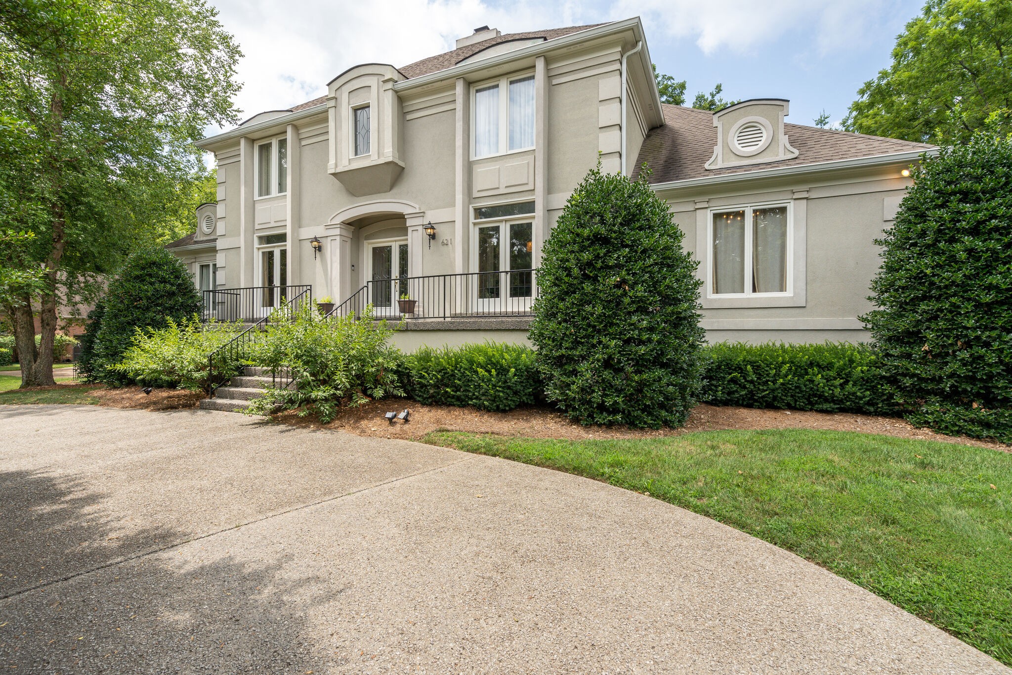 621 Post Oak Circle Brentwood, TN 37027 - Photo 4 of 50 front view of a house with a garden