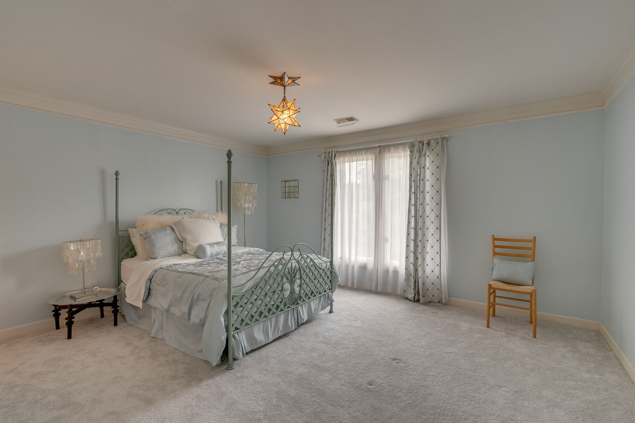 621 Post Oak Circle Brentwood, TN 37027 - Photo 31 of 50 a spacious bedroom with a bed and a chandelier
