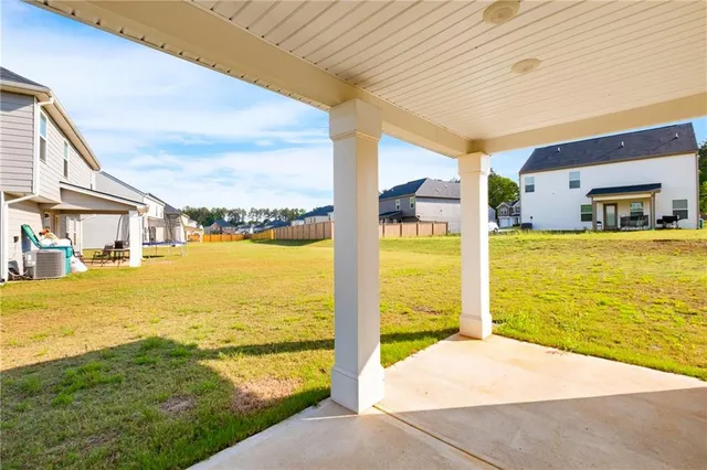 a view of a back yard of the house