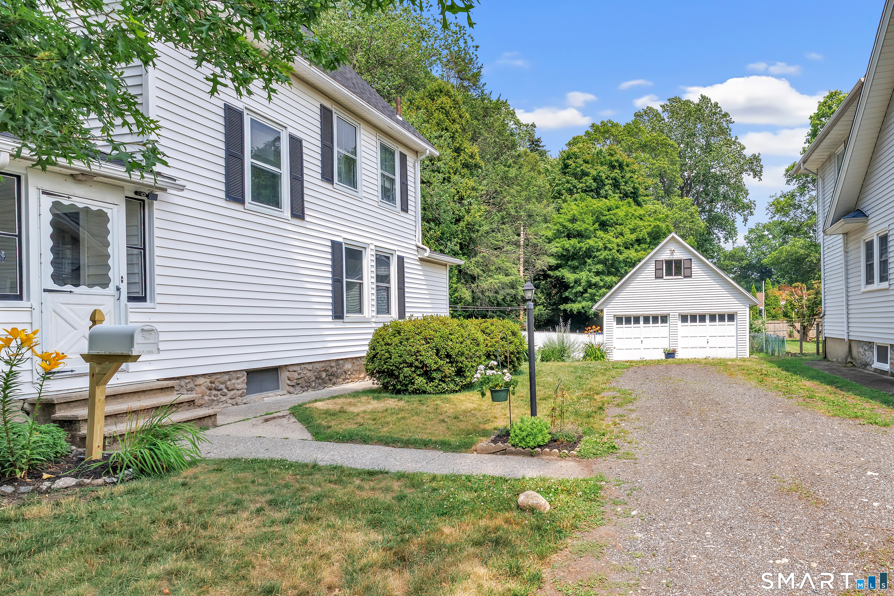1326 Huntington Road Stratford, CT 06614 - Photo 3 of 37 Charming Colonial Offering 1316 sq ft, 3 Beds, 2 Full Baths, .25 Acre rear backyard built for entertaining and gardening. Roof & garage roof installed 6/2026, Hardwood Floors both floors. Main Floor New windows 2022. 2 Car Garage with floored Attic