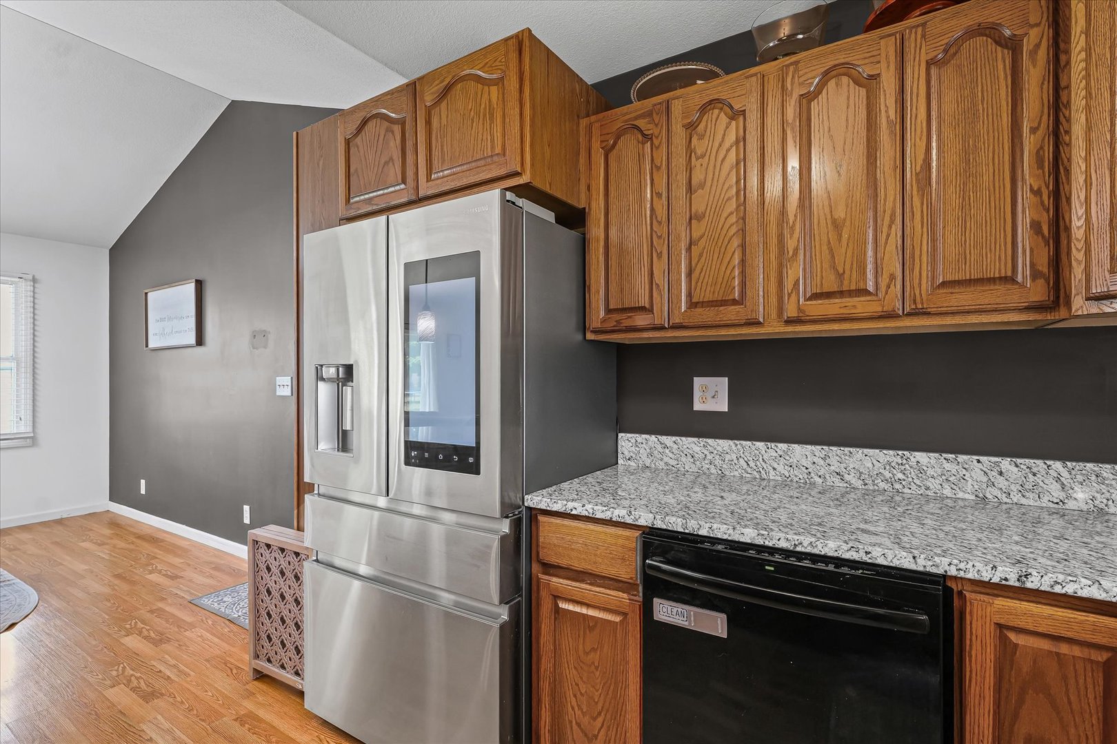 202 Hawk's Lane Broadlands, IL 61816 - Photo 13 of 31 a kitchen with granite countertop wooden cabinets and a granite counter tops
