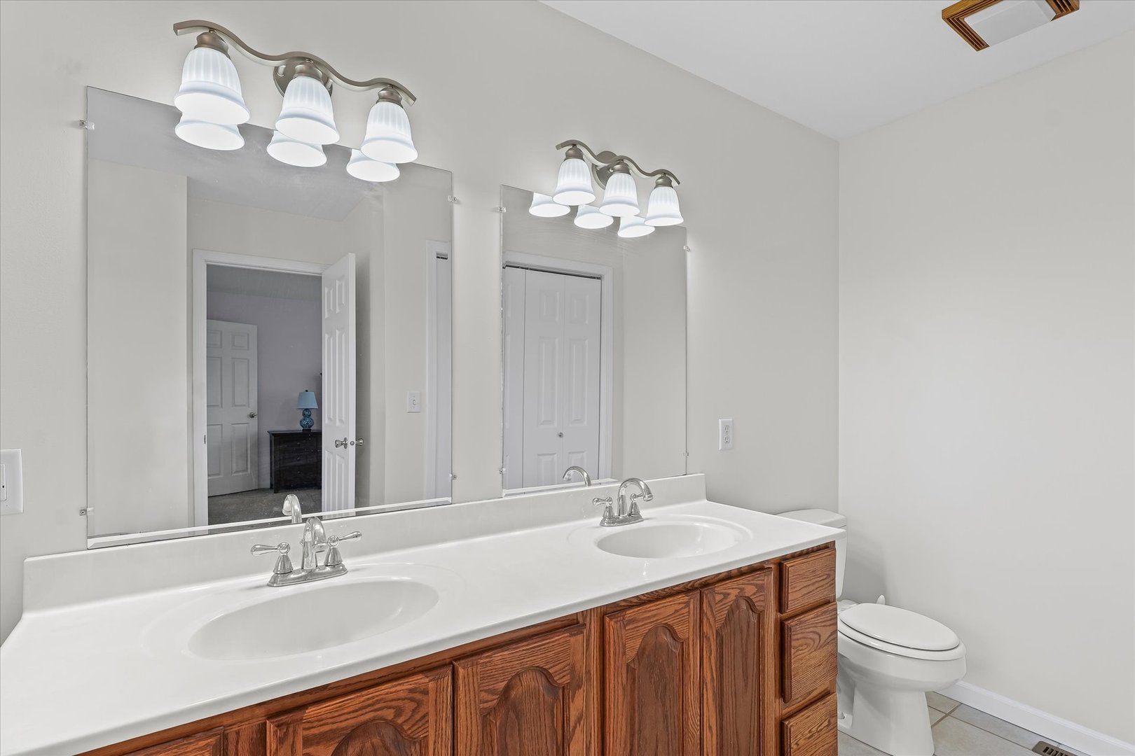 202 Hawk's Lane Broadlands, IL 61816 - Photo 18 of 31 a bathroom with a sink and a mirror