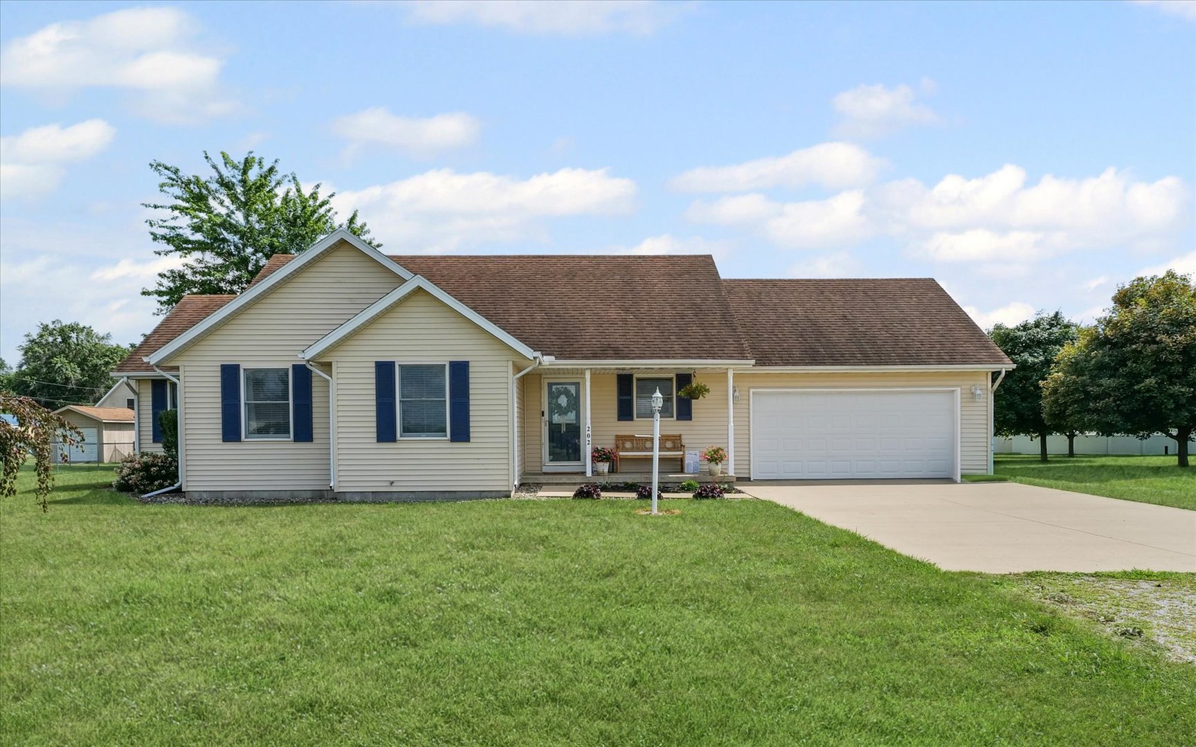 202 Hawk's Lane Broadlands, IL 61816 - Photo 2 of 31 a front view of house with yard and garage