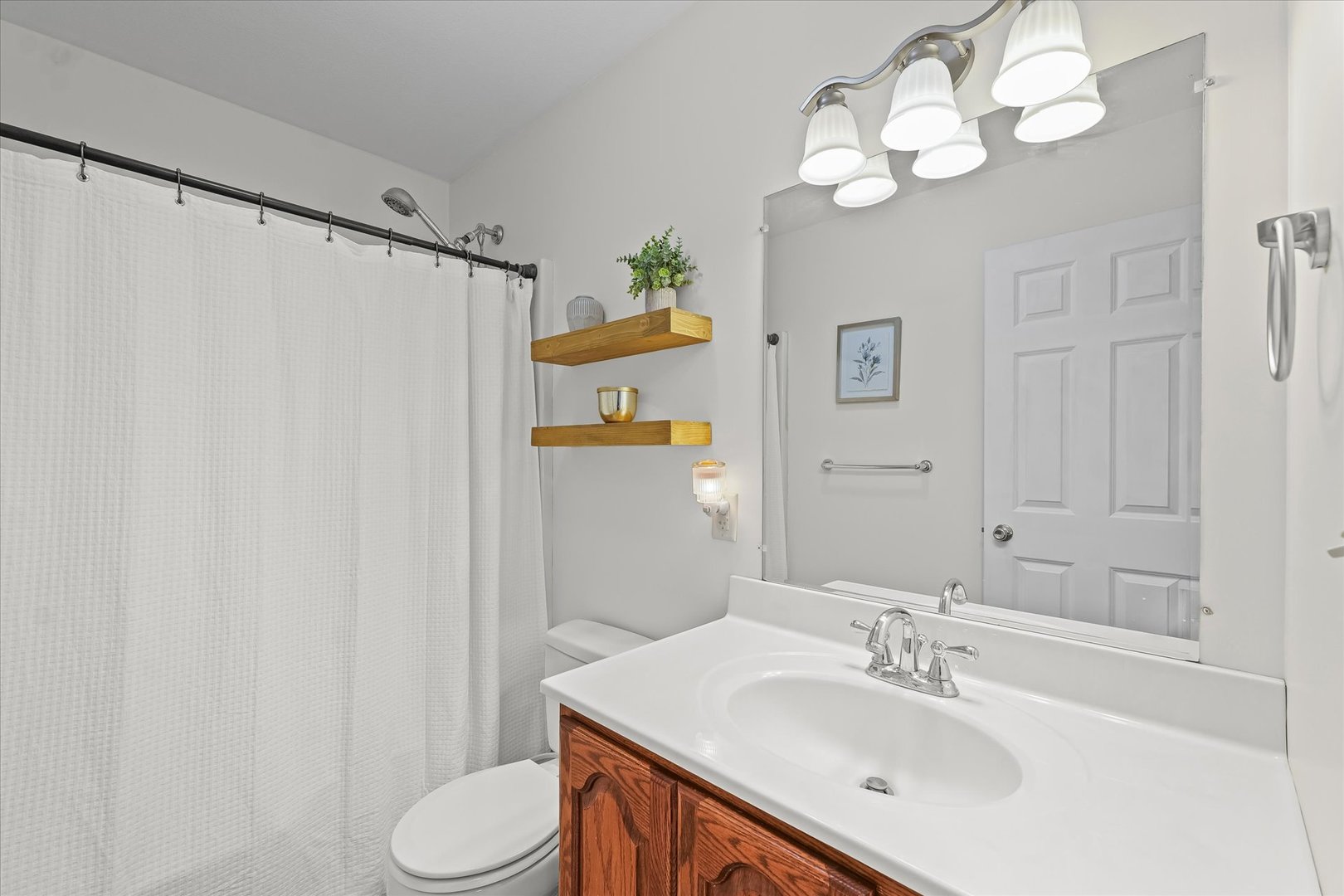 202 Hawk's Lane Broadlands, IL 61816 - Photo 24 of 31 a bathroom with a sink vanity mirror and toilet