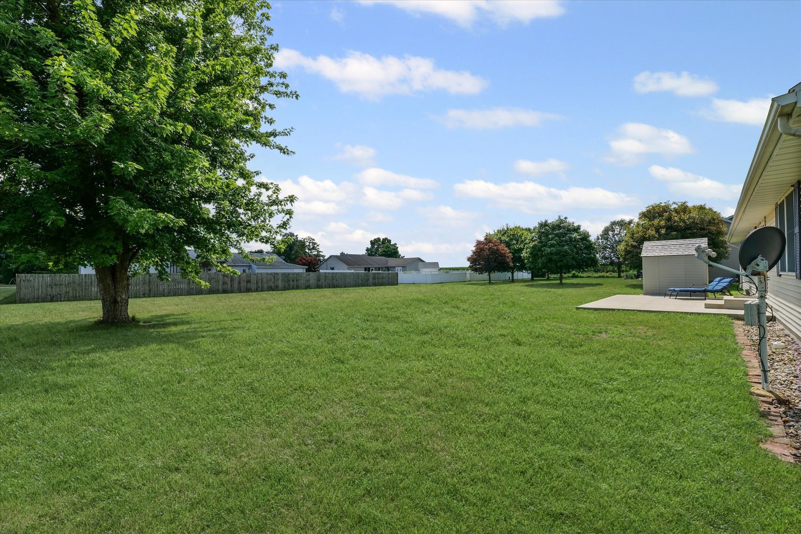 202 Hawk's Lane Broadlands, IL 61816 - Photo 27 of 31 a view of a green field with trees in the background