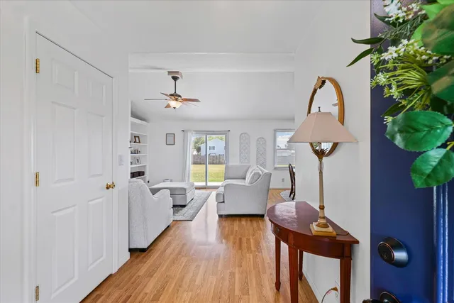 a very nice looking room with wooden floor and windows