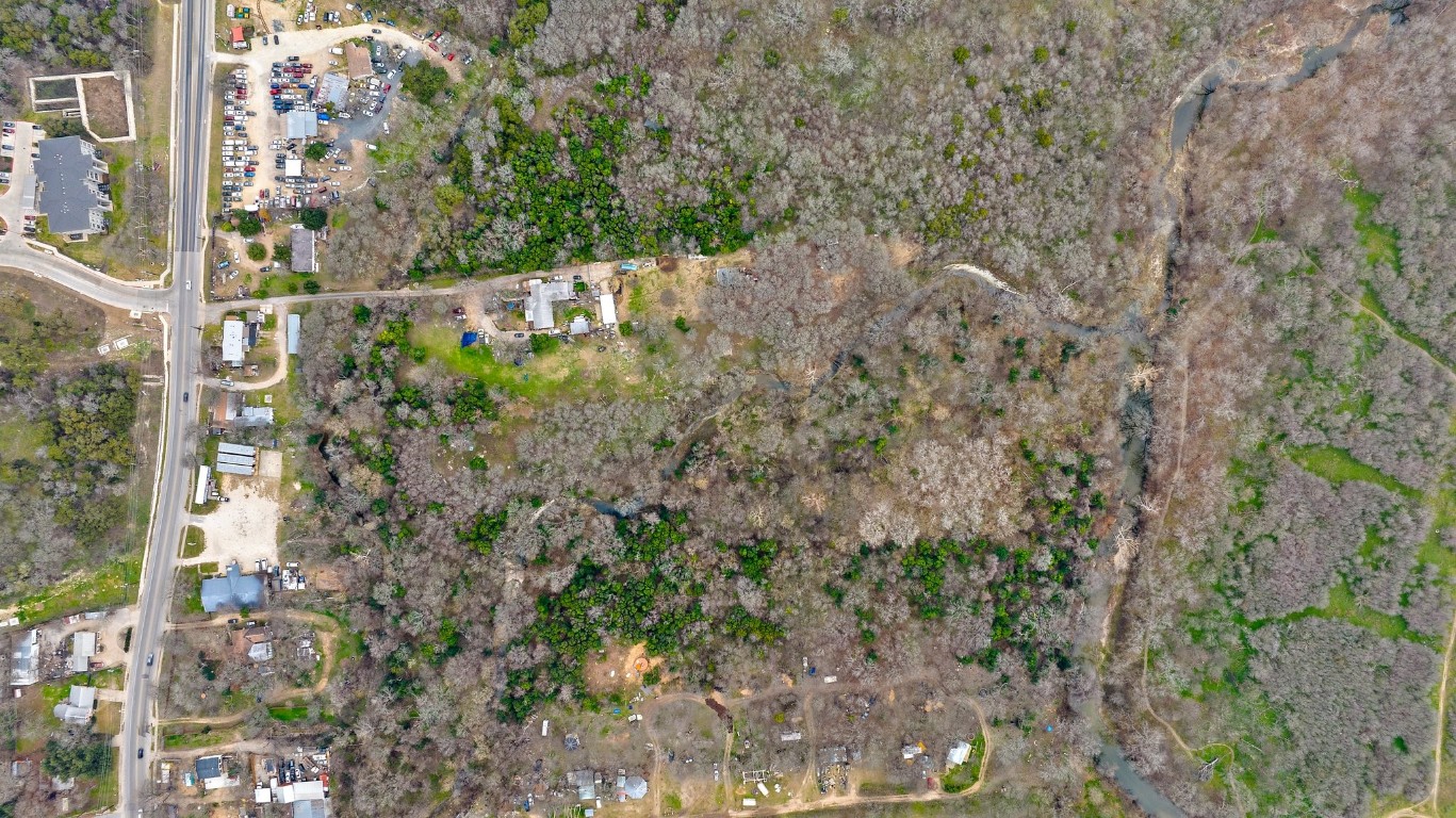 8303 Bluff Springs Road Austin, TX 78744 - Photo 13 of 16 a view of a yard with plants