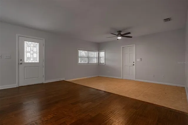 a view of an empty room with a window