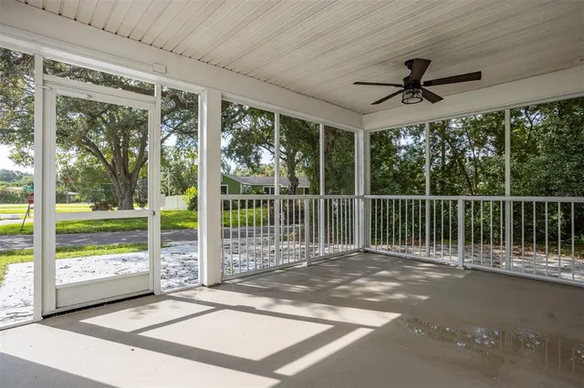 a view of a deck and a backyard