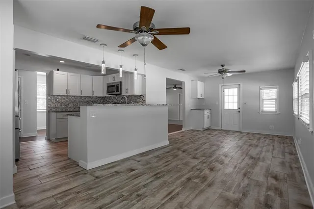 a view of a kitchen with a sink and cabinet