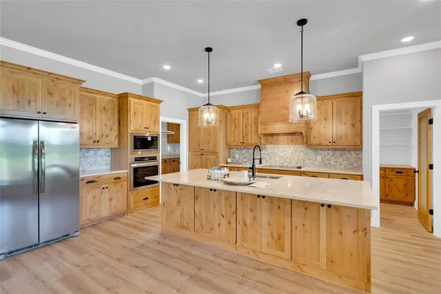 a bathroom with a double vanity sink a mirror and a bathtub