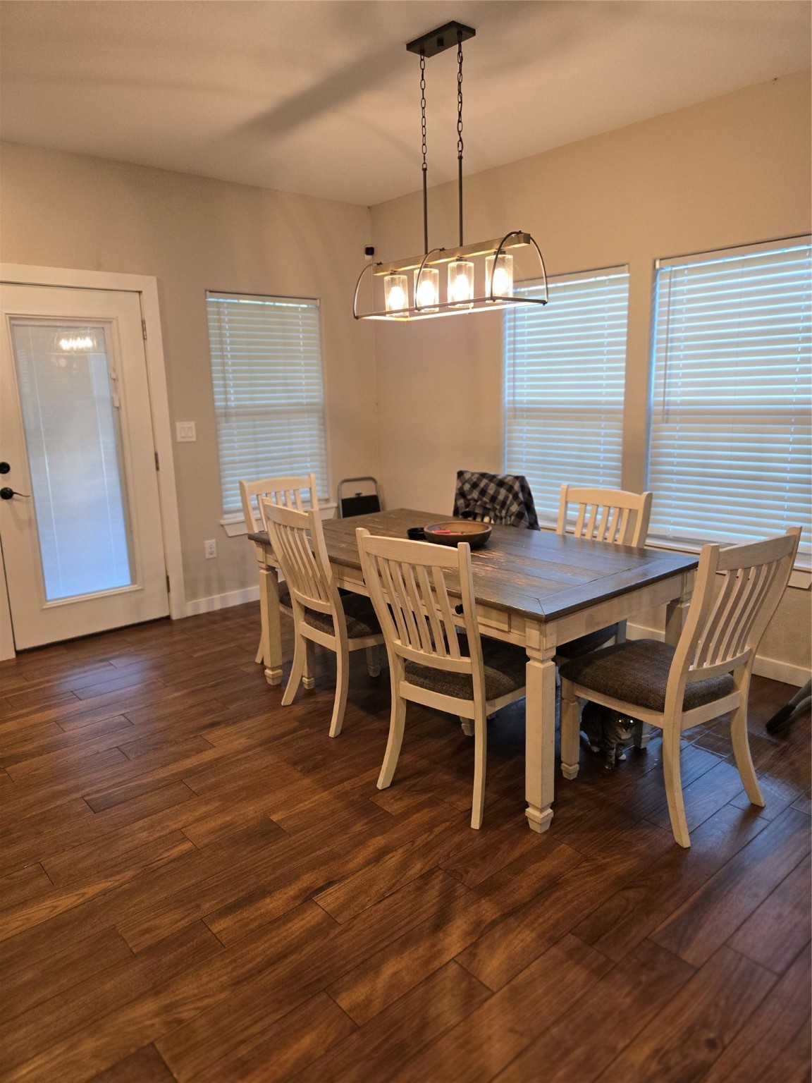125 Smith Street Clute, TX 77531 - Photo 5 of 11 a view of a dining room with furniture wooden floor and chandelier